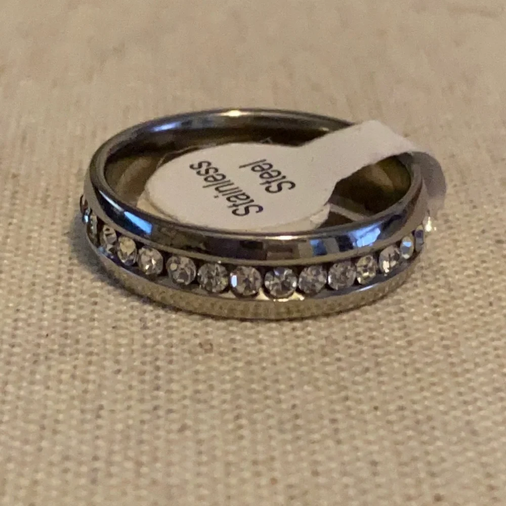 Stainless steel comfort band with CZ stones